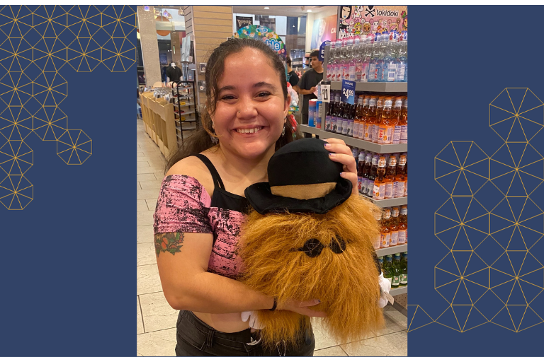 Amber smiling and holding a stuffed animal