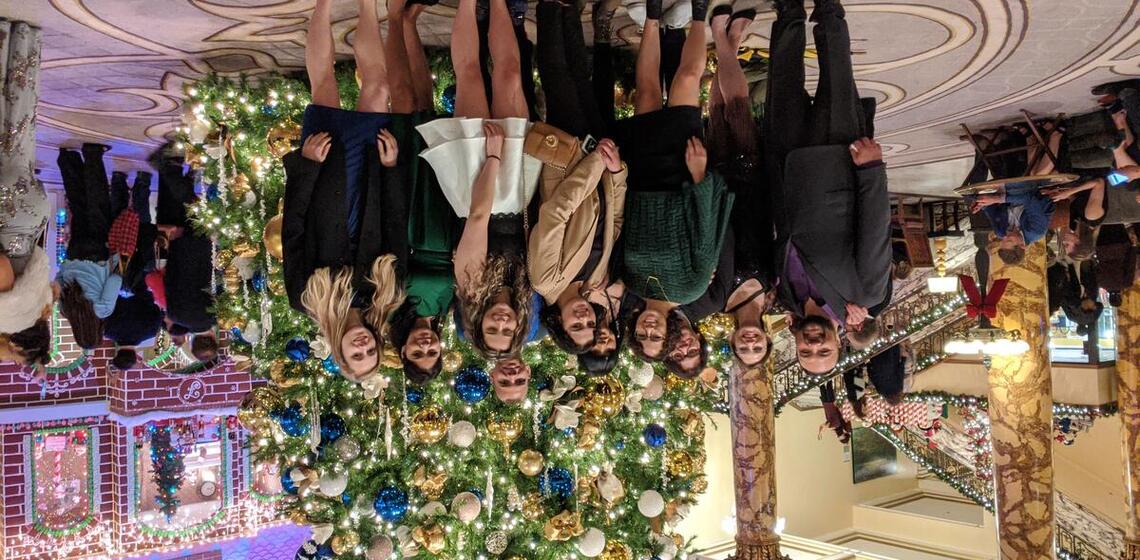 BHS students dress formal in front of a Christmas tree